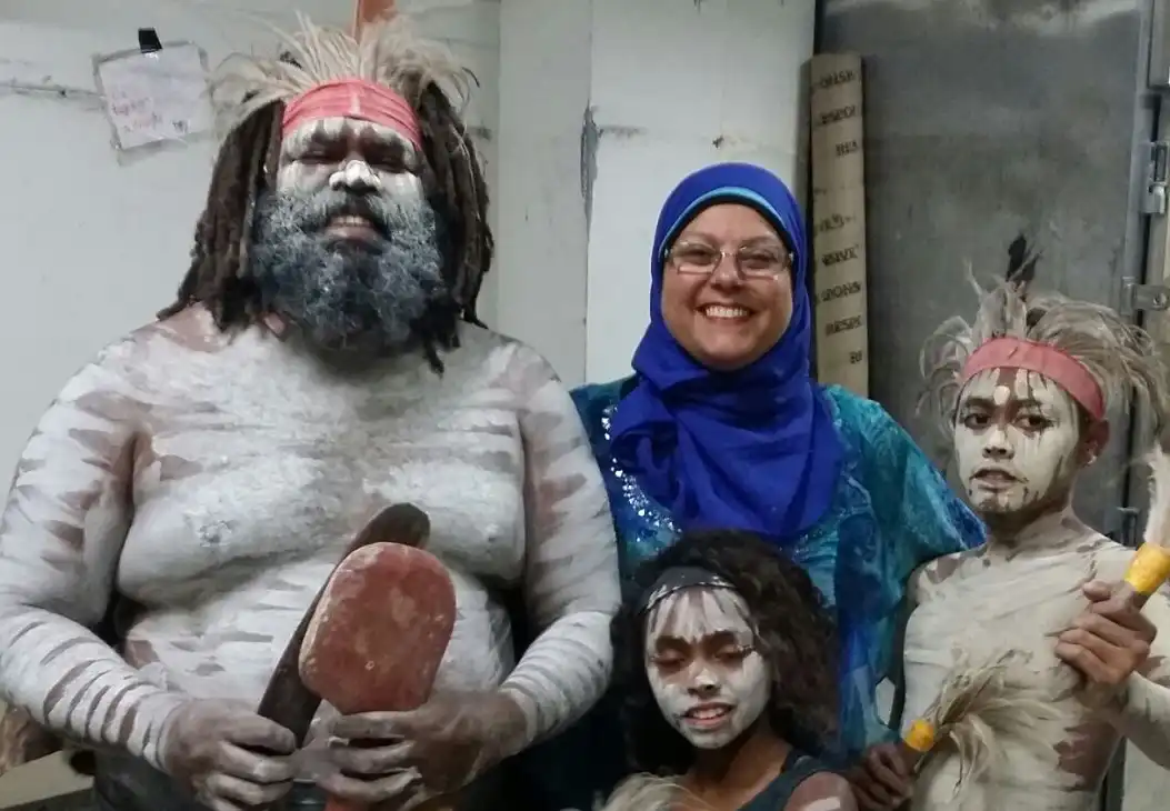 Najla Turk standing with native Australians
