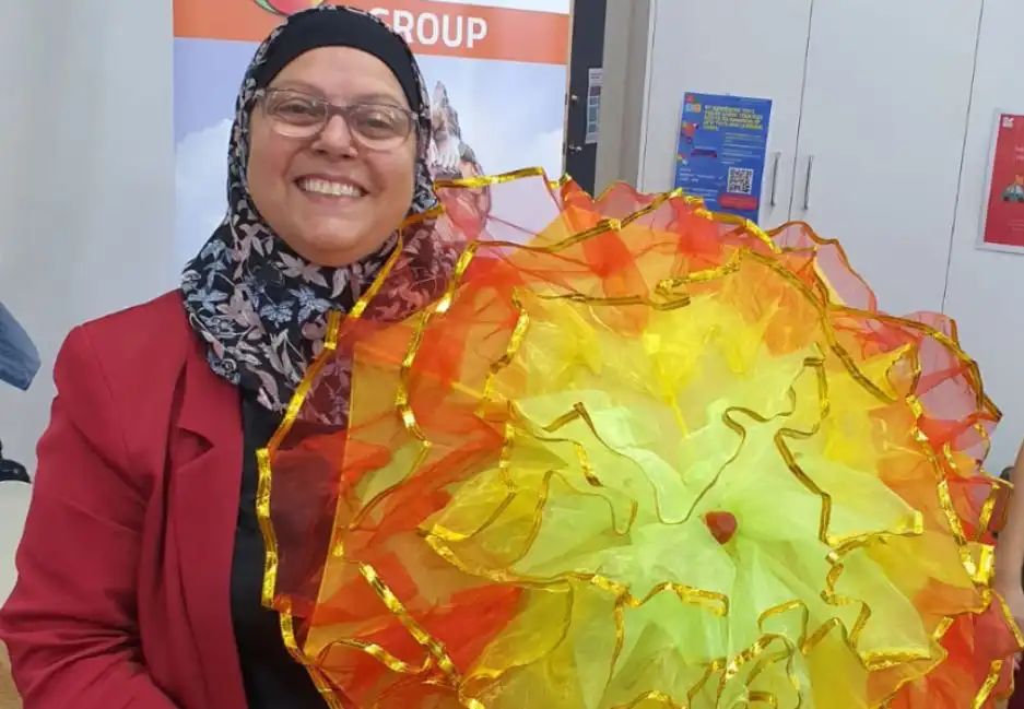 Najla Turk holding a cultural Chinese umbrella